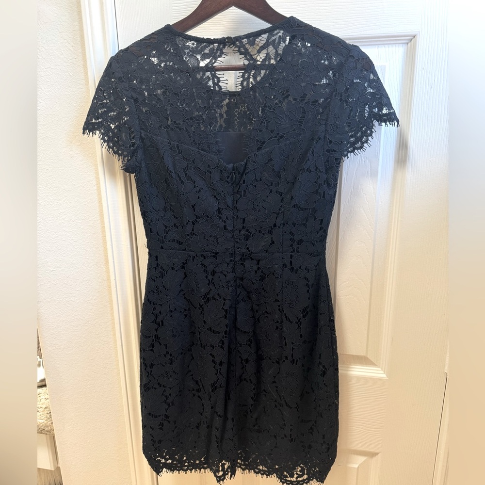 Beautiful black and lace floral dress. Worn once and dry cleaned afterwards.